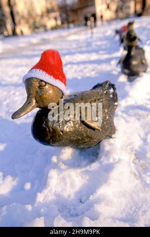 Santa Hats on the Make Way For Ducklings Statues, Boston Garden, Boston, Massachusetts, USA Stock Photo