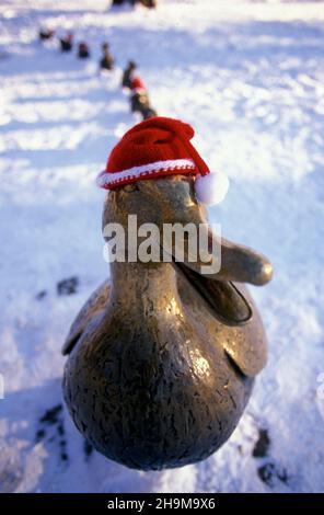 Santa Hats on the Make Way For Ducklings Statues, Boston Garden, Boston, Massachusetts, USA Stock Photo