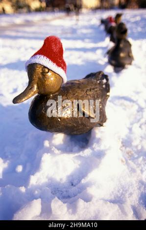 Santa Hats on the Make Way For Ducklings Statues, Boston Garden, Boston, Massachusetts, USA Stock Photo