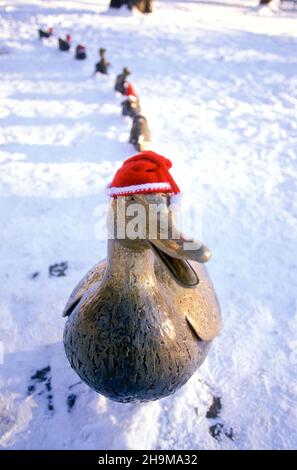 Santa Hats on the Make Way For Ducklings Statues, Boston Garden, Boston, Massachusetts, USA Stock Photo