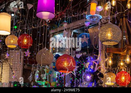 Modern  colorful lamps in retro style. Bright, colorful lights hang in an electrical store Stock Photo