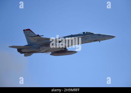 United States Marine Corps F/A-18C from VMFA-232, the  Red Devils on a high-speed flyby. Stock Photo