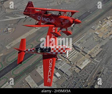 Sean D Tucker in close formation flight with his son and a lucky passenger over San Diego's Lindberg Field, AKA San Diego International Airport. Stock Photo