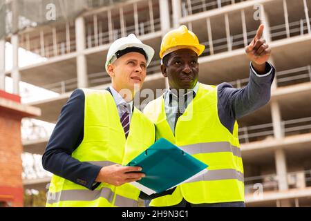 Two architects discussing construction project Stock Photo