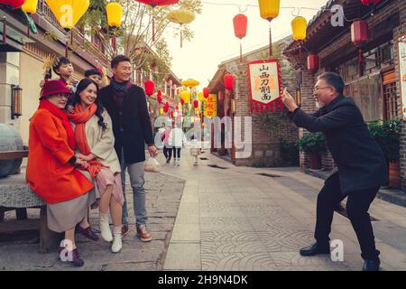 Temple fairs to pose for photos of family of six Stock Photo