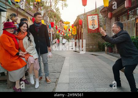 Temple fairs to pose for photos of family of six Stock Photo