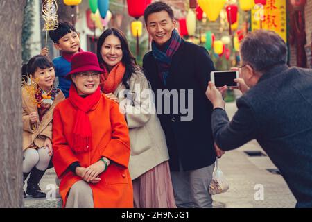 Temple fairs to pose for photos of family of six Stock Photo