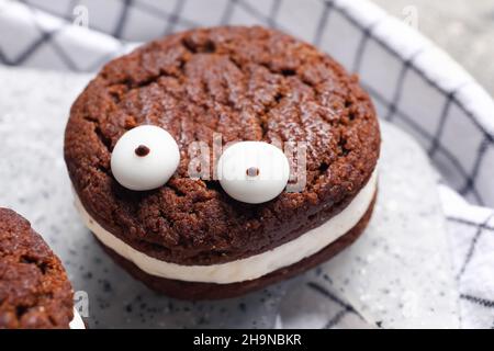 Funny cookie for Halloween on table, closeup Stock Photo
