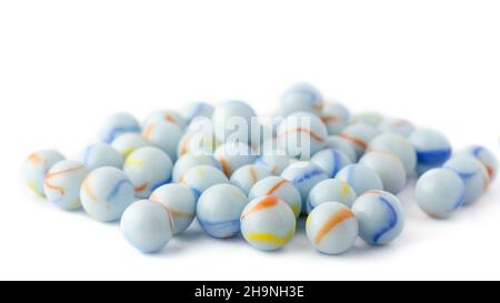 blueish white crystal spheres, colorful marbles taken in shallow depth of field, isolated on white background Stock Photo