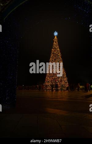 Yalta Crimea December 28, 2019. New Year decorations of the city. Bright festive lights sparkle in the night city. Blurry background without people. T Stock Photo