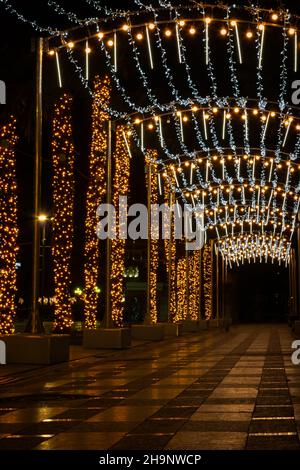 Yalta Crimea December 28, 2019. New Year decorations of the city. Bright festive lights sparkle in the night city. Blurry background without people. T Stock Photo