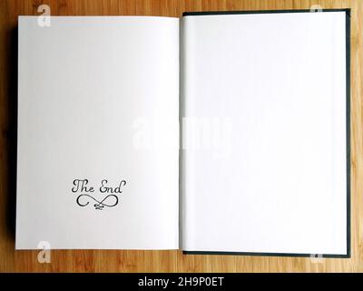A sketchbook open on the last page with 'The End' written by pencil Stock Photo