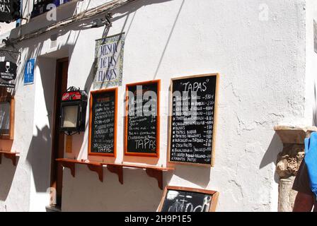 Typical tapas menu boards outside a bar in the old town, Cordoba, Spain Stock Photo