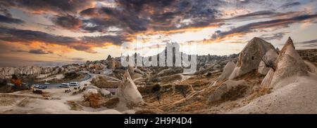 Uchisar Castle, town in Cappadocia, Turkey near Goreme at sunrise. Panorama of Cappadocia landscape and valley with ancient rock formation and caves. Stock Photo