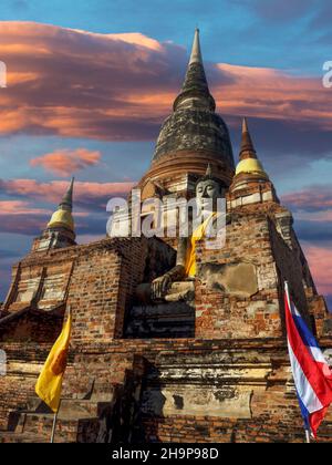 Buddha statue in front of the central stupa, Wat Yai Chai Mongkhon, Thailand, Asia Stock Photo