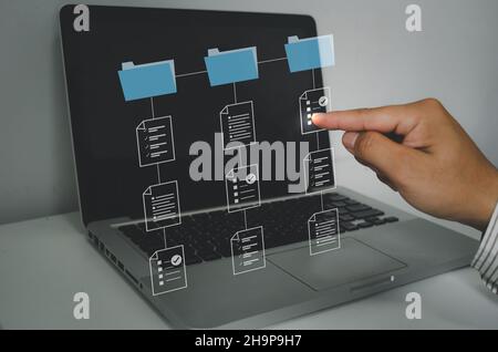 Document Management System (DMS), Businessman work on laptop online documentation database corporate. Internet Technology Concept. Stock Photo