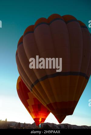 Hot air balloons. Hot air balloons ready to take off. Cappadocia ballooning activities story vertical background photo. Stock Photo
