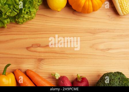 vegetable concept various vegetables such as lettuces, lemons, pumpkins, corns, tomatoes, broccolis, beetroots, bell peppers and carrots being put on Stock Photo