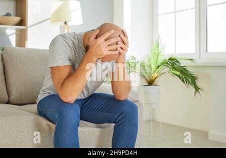 Sick man suffer from headache feel unwell Stock Photo