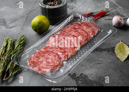 Salami Milano pack Italian sausage set, on gray stone table background Stock Photo