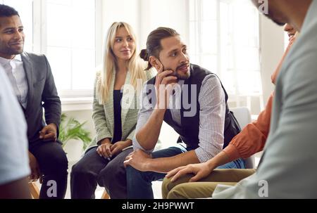 Diverse team of happy young business people having a work meeting in their office Stock Photo