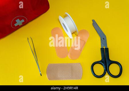 First aid kit on the yellow background Stock Photo
