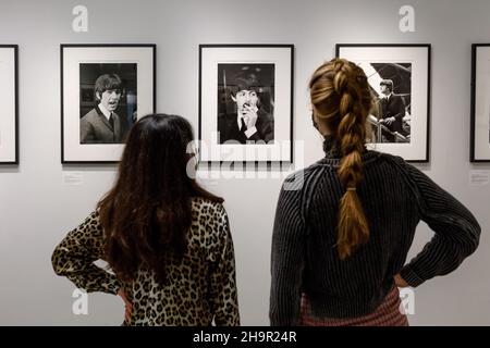 Lost photographs of The Beatles, Shapero Modern Gallery, London, UK. 8th December 2021. Candid photographs of The Beatles on the set of their first film A Hard Day’s Night, go on display for the first time at Shapero Modern Gallery, London. Lord Thynne, son of the 6th Marquess of Bath, captured these images in the spring of 1964. They were recently rediscovered in family papers after 57 years and developed from negatives. On display in a rare exhibition, 09/12/2021 - 16/01/2022.  Amanda Rose/Alamy Live News Stock Photo