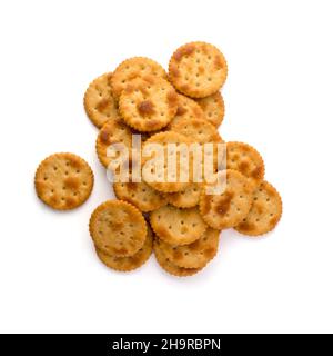 pile of spicy biscuits, crispy and crunchy crackers, tea time snack isolated on white background Stock Photo