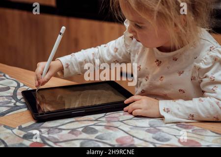 Little girl using ipad Stock Photo