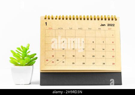 The January 2022 desk calendar on white table. Stock Photo
