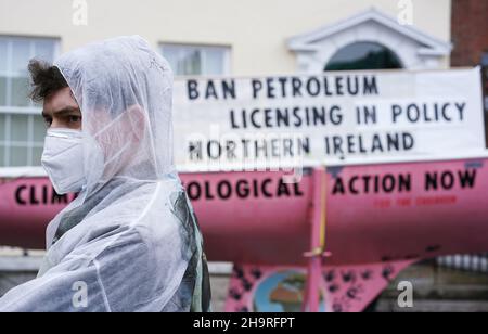 Extinction Rebellion activist Oscar Mooney, from Sandymount, as the group held a demonstration outside Sinn Fein’s headquarters in Dublin calling on the party to act now in the Northern Irish Executive to ensure a full and final ban on petroleum licensing. Picture date: Wednesday December 8, 2021. Stock Photo
