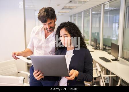 Business people working together on laptop computer during website development Stock Photo