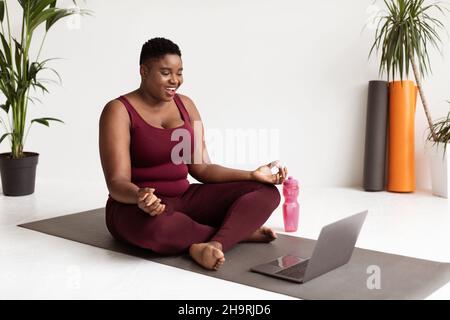 fat cheerful woman doing yoga in the park, plus size model Stock Photo -  Alamy