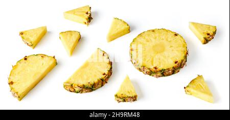 Composition of pineapple pieces and slices isolated on white background Stock Photo