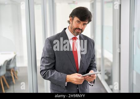Successful businessman or consultant using tablet computer in the office Stock Photo