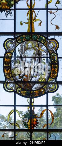 Stained glass window of wreathed oval roundel in Renaissance style by Frederick Charles Eden (1864-1944), Barsham church, Suffolk, England, UK c 1907 Stock Photo