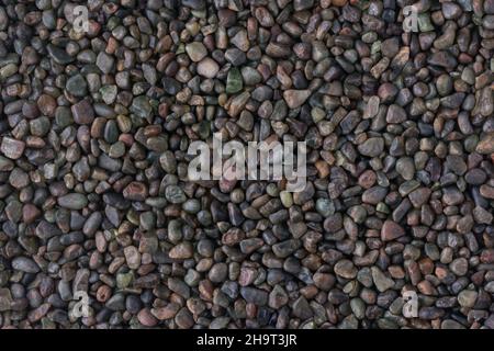 decorative pebbles, dark blue color stones background texture, wallpaper abstract Stock Photo