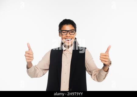 Happy african american businesswoman winking and showing like isolated on white Stock Photo