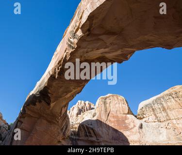 Fruita, Capitol Reef National Park, Utah, USA. Low angle view of Hickman Bridge from the Hickman Bridge Trail at the foot of the Waterpocket Fold. Stock Photo