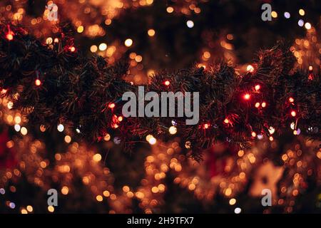 Colorful neon lights on christmas ornaments. Beautiful light decoration with lots of color and bokeh background. Stock Photo