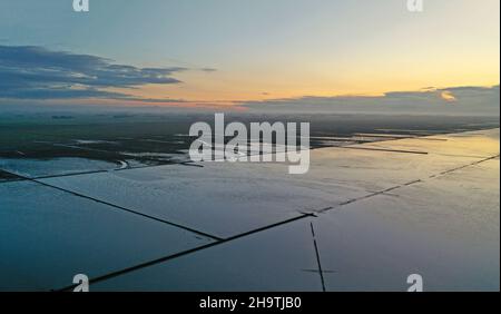 sunset over the wadden sea at low tide, Netherlands, Frisia, Holwerd Stock Photo