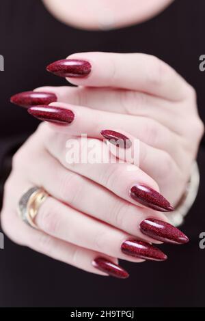 Portrait of a beautiful woman with classic make up in glamorous style,  creative long nails. Stock Photo by Kobrinphoto