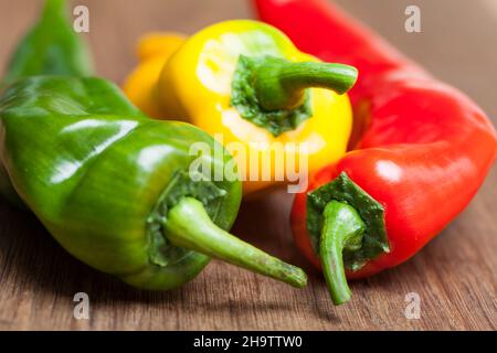 Peppers, colorful, colorful, vegetable, wooden board, food, close-up, food, background, wood, green peppers, green board, red, standing, multiple colo Stock Photo