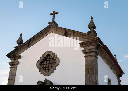 The sun sets over Capela do Senhor da Praça along the Camino Portuguese in Rates, Portugal. This route of the Camino de Santiago pilgrimage runs north Stock Photo