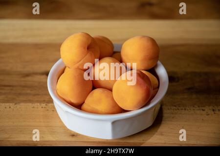 Selected focus closeup on apricots in a bowl Stock Photo