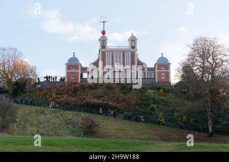 London, Greater London, England, December 04 2021: People walking to and enjoying the view from The Royal Observatory in Greenwich Park. Stock Photo