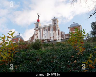 London, Greater London, England, December 04 2021: The Royal Observatory as seen through the foliage on the hill in Greenwich Park. Stock Photo