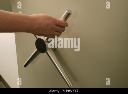 "24.11.2021, Germany, Bremen, Bremen - Door to a safe room in a roughened branch of the savings bank from the founding period.. 00A211124D249CAROEX.JP Stock Photo