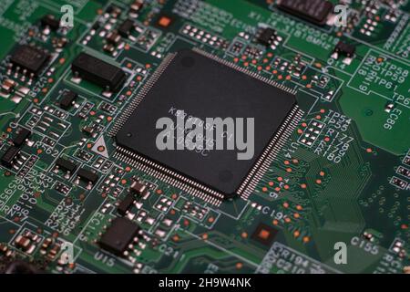 Part of an electronic printed circuit board with many electrical components. Stock Photo