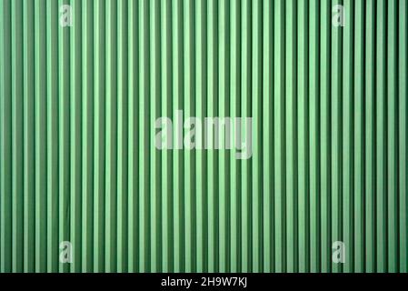 bright vertical folding blinds bright green Stock Photo